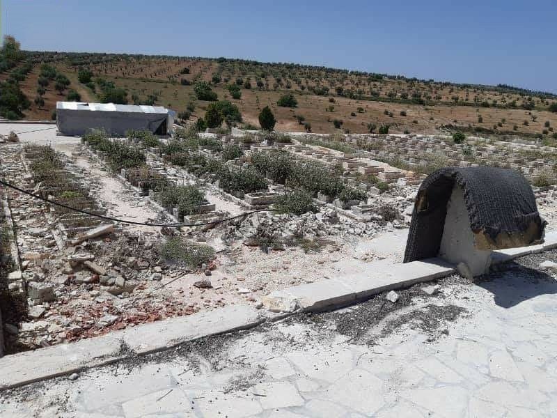 In pictures: Tank tracks of Turkish occupation over martyrs' gravestones in the cemetery of 