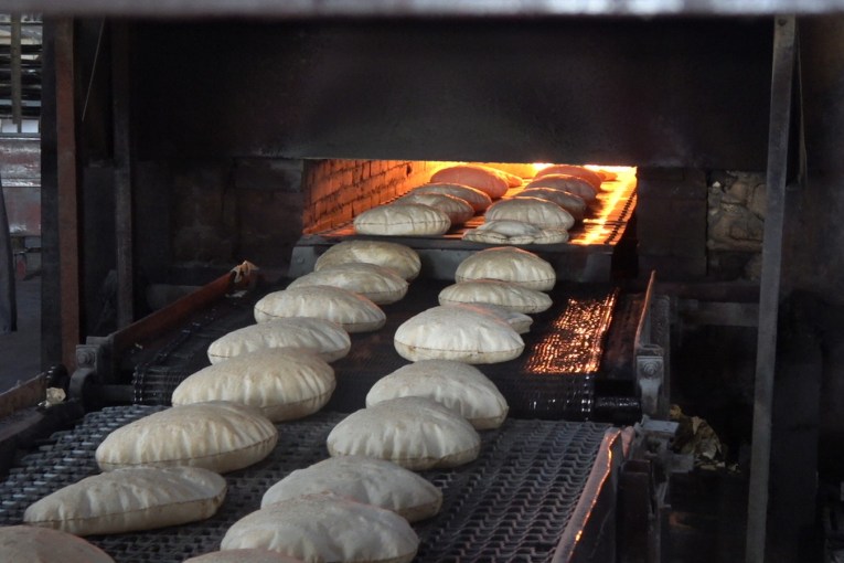 Settler takes over the basement of a building, to turn it into a bakery