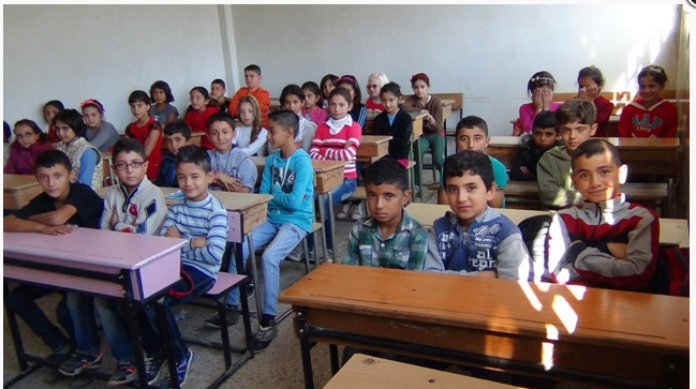 A teacher gives Kurdish language lessons in secret in occupied Afrin