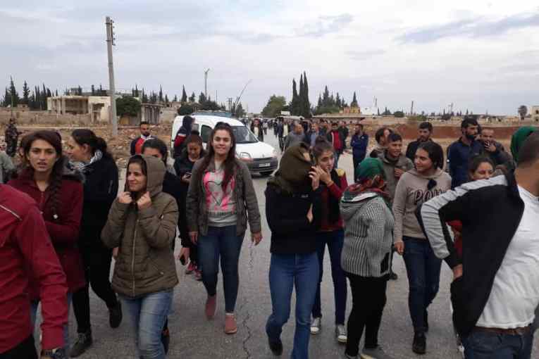 Pictures: Afrin displaced people demonstrate in front of a checkpoint of the Syrian regime ... to protest against its siege on Shahba areas