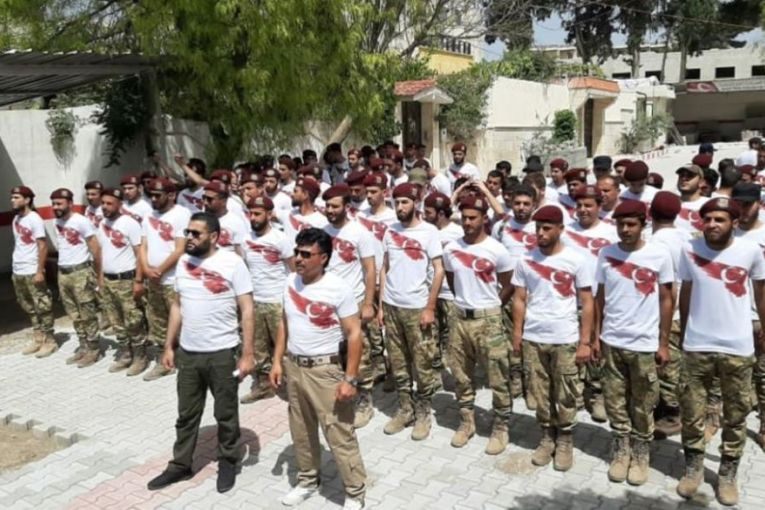 Military Police militia arrests a settler who criticized the Turkish flag on their new uniform