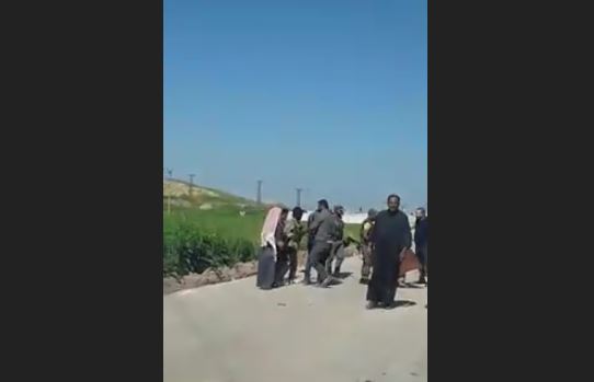 A Turkish occupation army officer assaults a civilian in the north of Raqqa