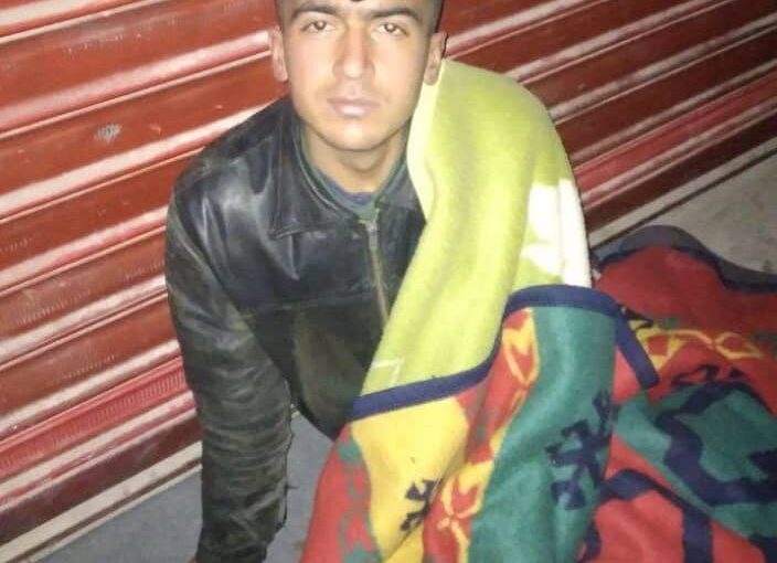 Kurdish young man, forcibly deported from Turkey, sleeps on sidewalks in Afrin